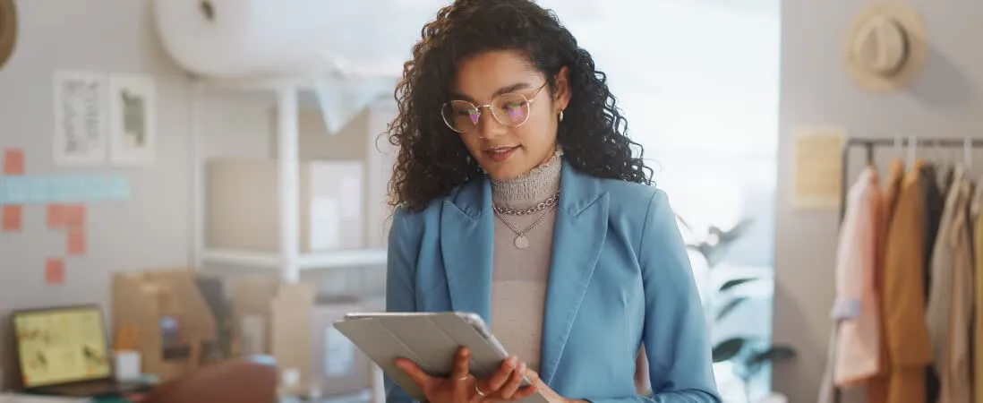 woman looking at her tablet