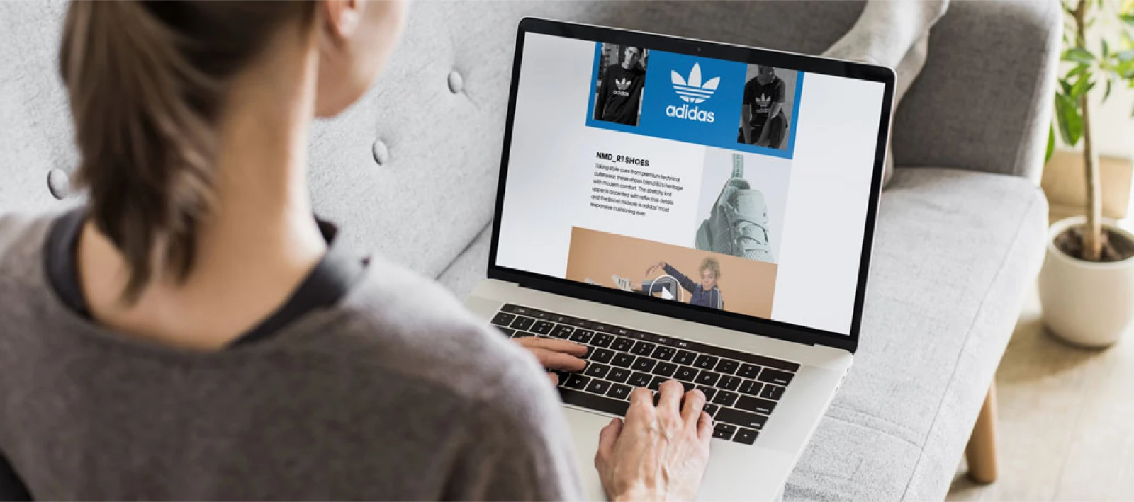 Woman looking at a branded storefront on laptop