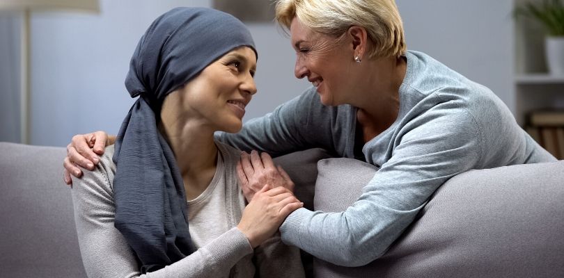 A mom talking to her daughter about colon cancer treatment.