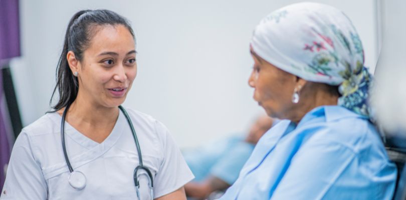 A doctor speaking with a patient.