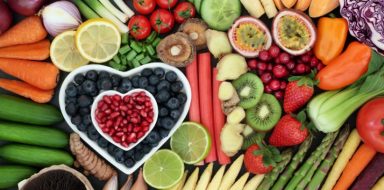 An assortment of fruits and vegetables laid out on a table.