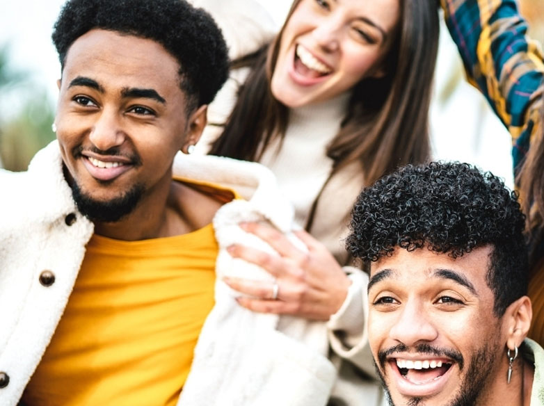 A group of young adults smiling